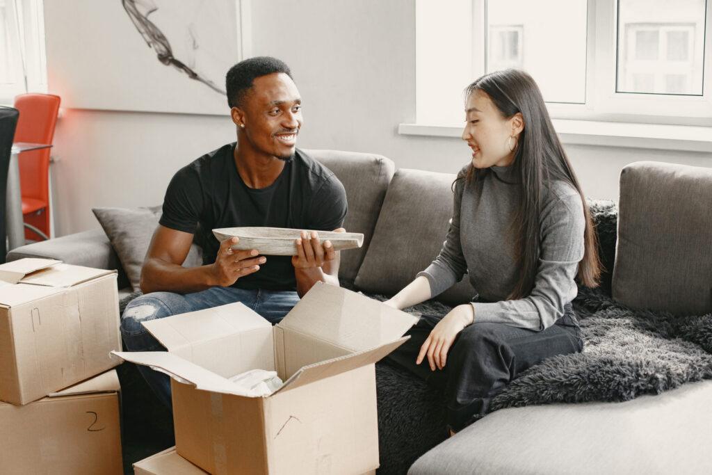 Couple unpacking boxes at their new home