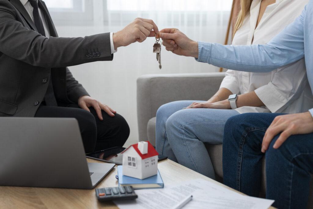 person handing over keys