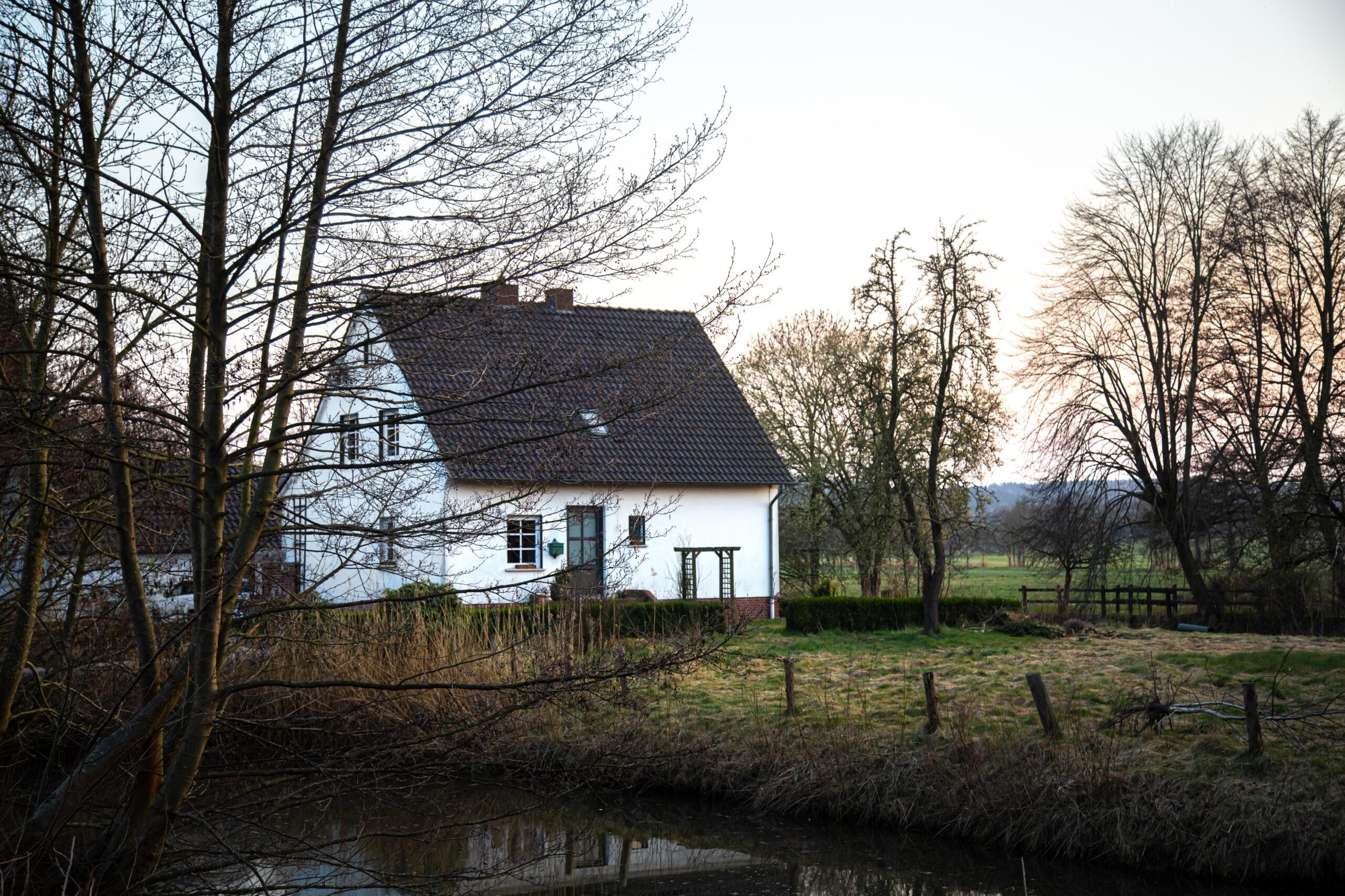 A rural cottage among trees