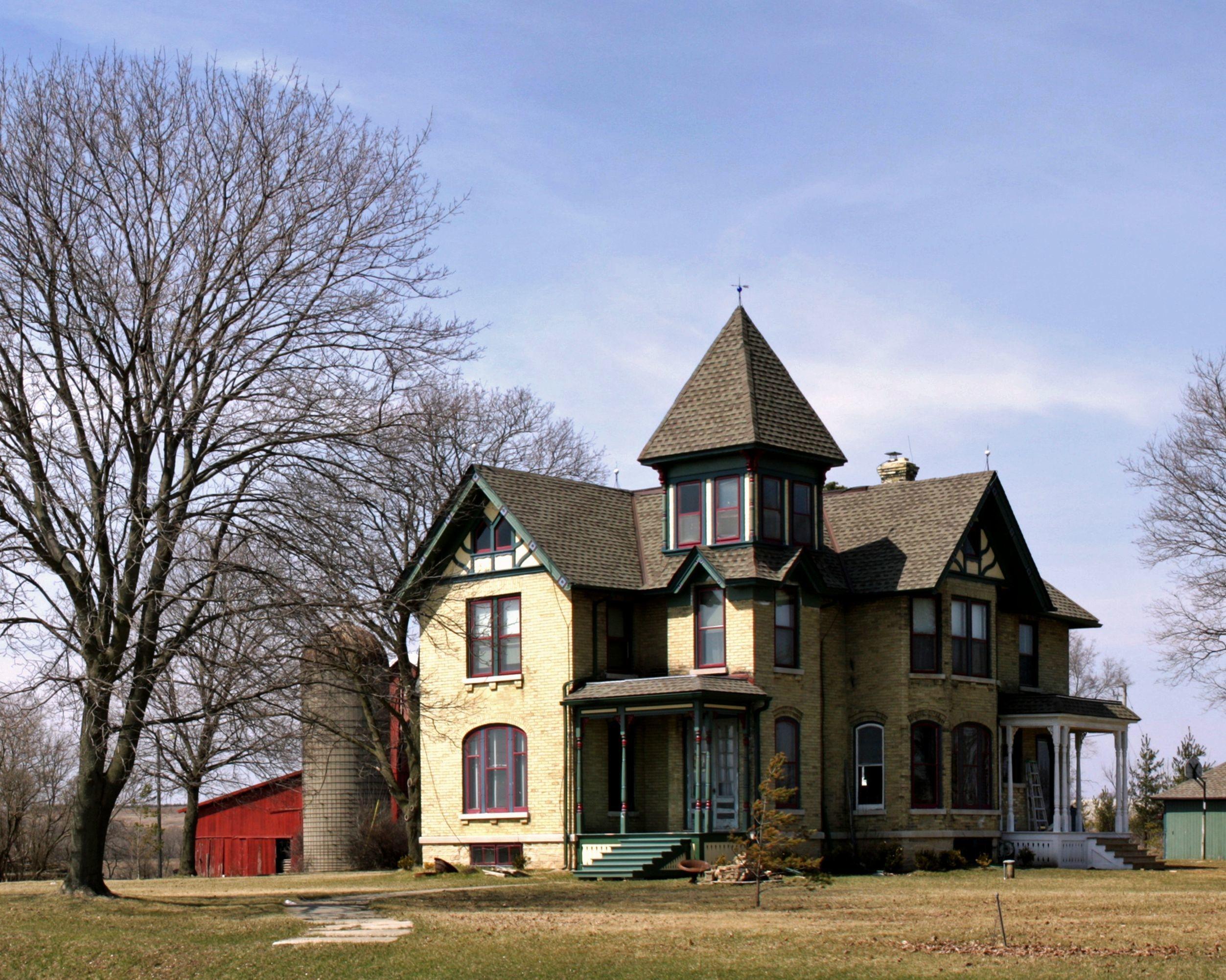 A farmhouse and outbuildings